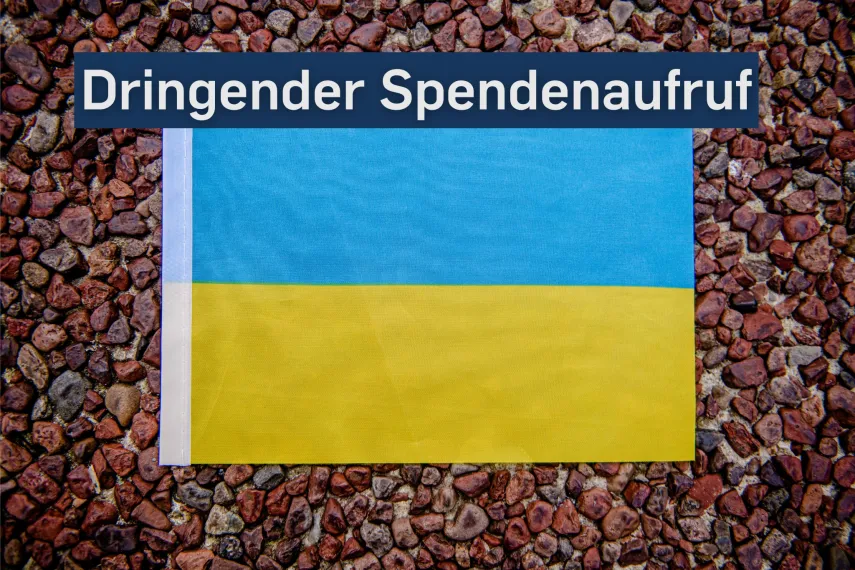 Ukrainische Flagge mit Spendenaufruf